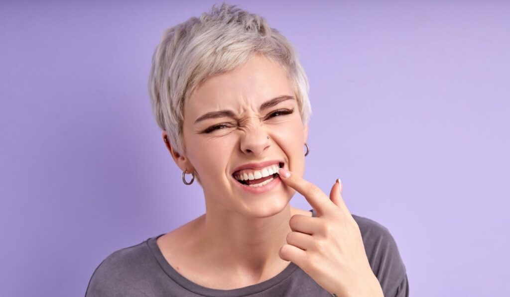 Short Haired Woman Checking Teeth 