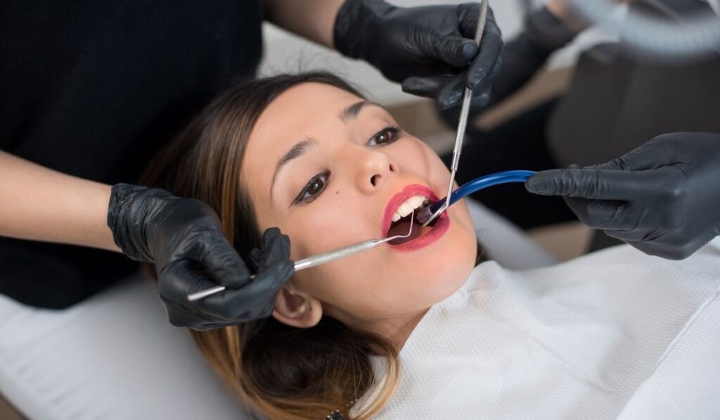Beautiful girl having dental check up in dental clinic 