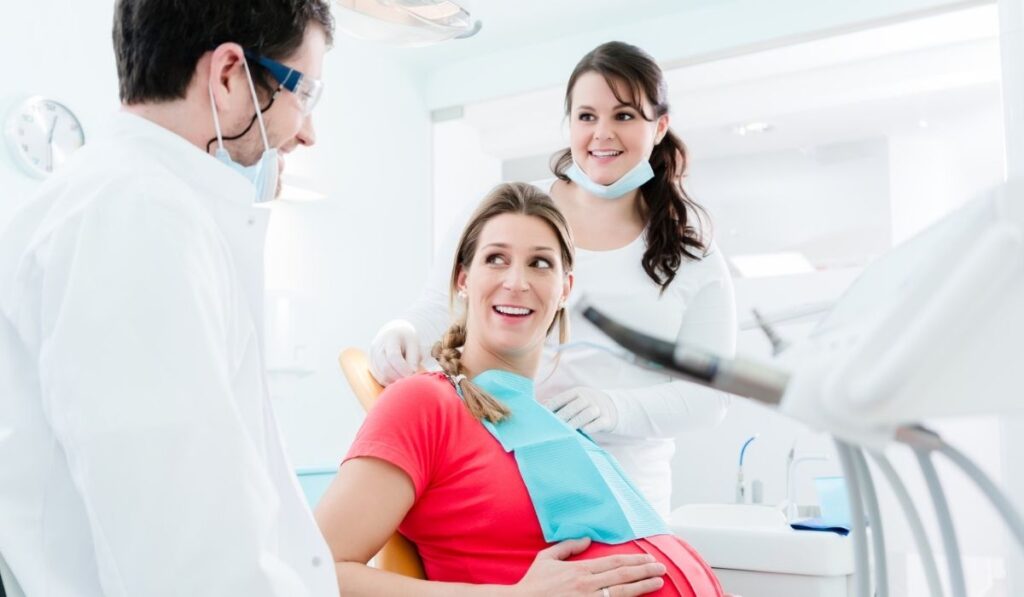 Pregnant woman at dentist before treatment -