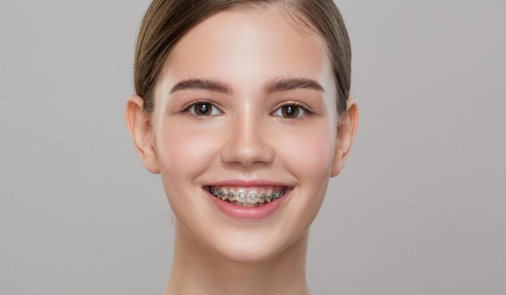 Portrait of a cute smiling girl in braces 