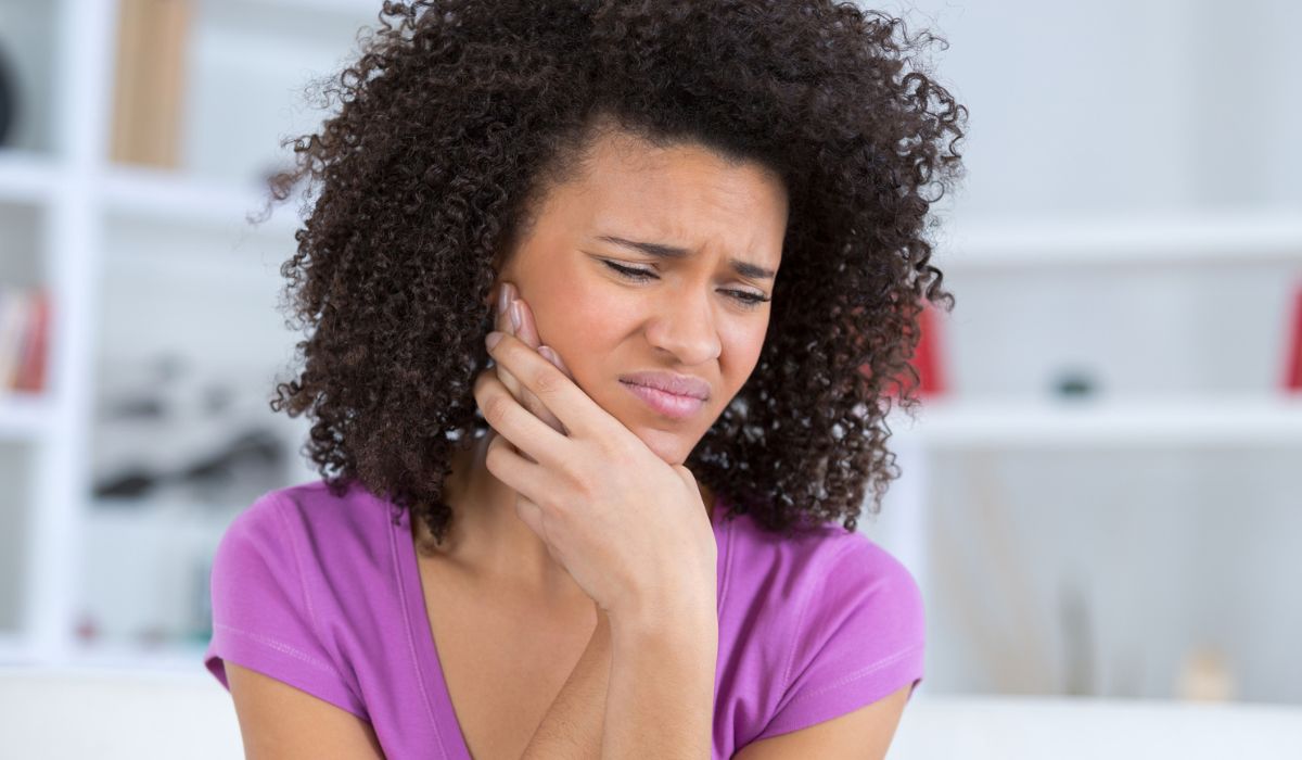 Pretty african american young woman have toothache